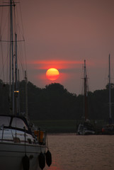 Red orange sun at sunset