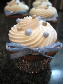 Chocolate cupcakes with blue ribbon