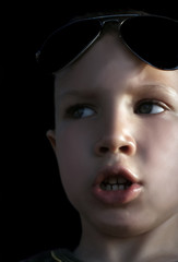 a boy is talking and looking