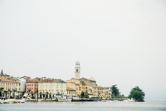 italian village with harbor and a church