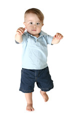 Adorable Boy Toddler walks forward over white