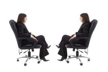 Businesswoman sitting on the chair with mirror image 