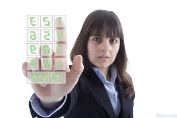 Business woman dialing numbers in a touchscreen
