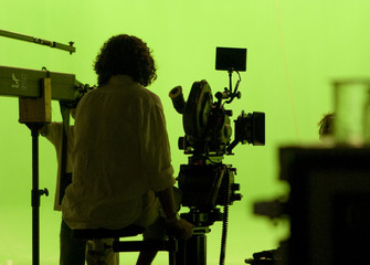 Cameraman Against a Greenscreen