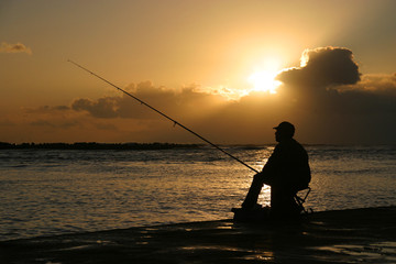 fishing at sunset
