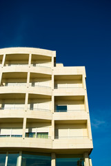 A repetition of balcony on a very blue saturated sky.