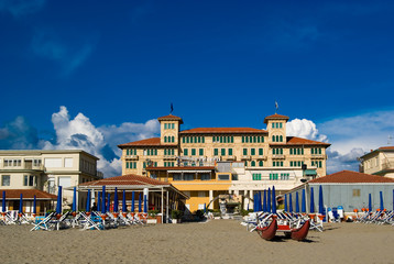 Viareggio's sandy beach with an old style hotel