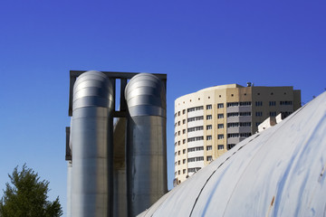 The big pipeline and the new constructed apartment house.