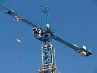 A construction crane over a blue sky