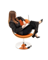 businesswoman with laptop in orange chair over white