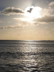 Cloudy Sunset over Sparkly Ocean Waters
