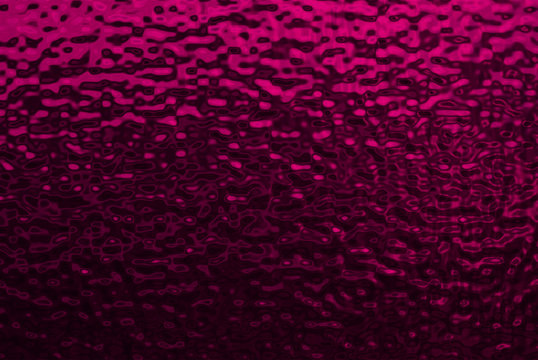 Background image of bumpy dark pink metallic texture