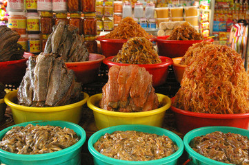 Varied fish in bowls in vietnamese market