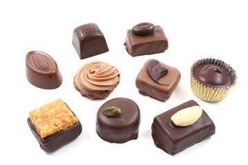 close-ups of mixed chocolates isolated on white