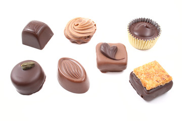 close-ups of mixed chocolates isolated on white