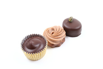 close-ups of mixed chocolates isolated on white