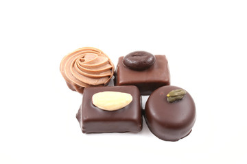 close-ups of mixed chocolates isolated on white