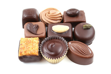 close-ups of mixed chocolates isolated on white