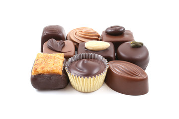 close-ups of mixed chocolates isolated on white