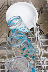 close up of glasses and bowl in a dishwasher