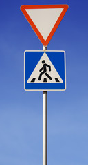 Road sign, pedestrian across road