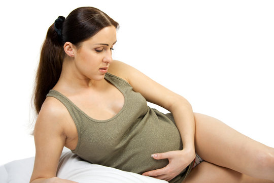 Happy pregnant young women. Isolate on white