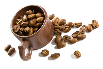 Coffee grains in brown cup