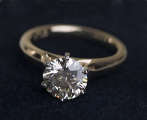 A very large diamond wedding ring on a black background