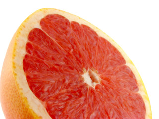 Slices of a grapefruit. A close up. Isolated on a white.