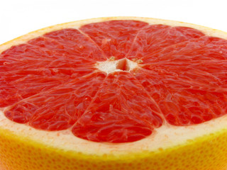 Slices of a grapefruit. A close up. Isolated on a white.