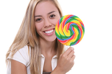 A young pretty woman with a lollipop over white