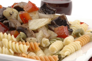 Vegetable pasta topped with mushrooms and fennel.