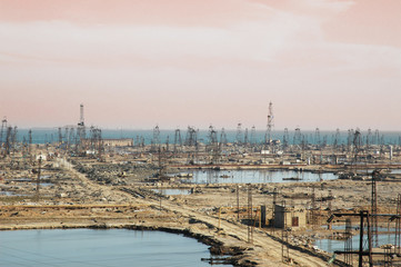 Many oil derricks on the shore near Baku, Azerbaijan