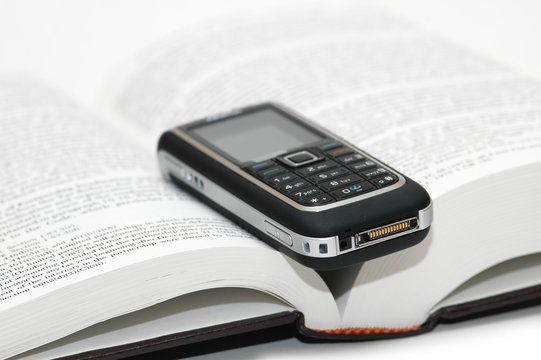 Mobile cellular phone over the study book