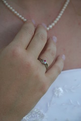 hand touching necklace ring jewelry pearl finger wedding