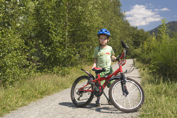 Naklejka premium little boy on the bike