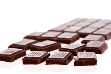 Dark chocolate bars on white background