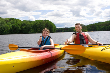 Father and son enjoying kayaking