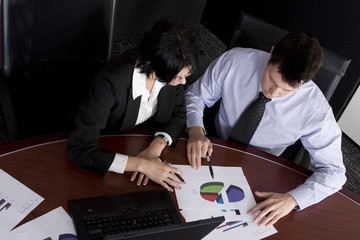 Business workgroup interacting in a boardroom setting