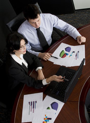 Business workgroup interacting in a boardroom setting
