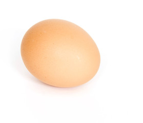 Brown egg on white background