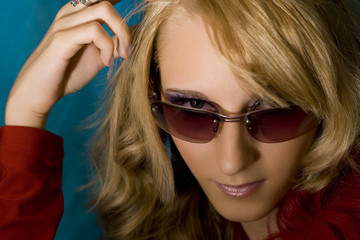 Portrait of young beautiful  blond girl in sun glasses