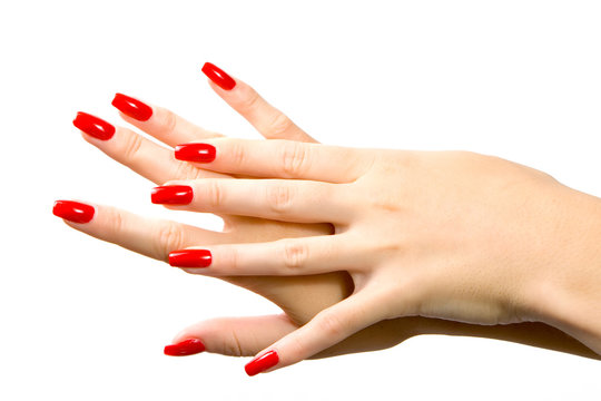 Woman hand with red nails isolated in white background