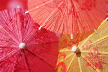 Paper parasols in pink, orange and yellow