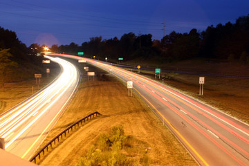 Fototapeta na wymiar Blurred car lights at night