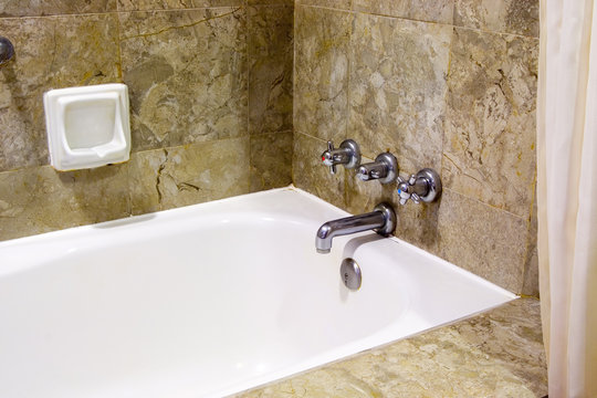 Interior of a resort hotel bathroom showing the bathtub