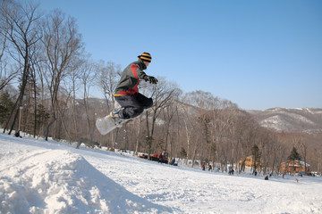 Fototapeta na wymiar jump of snowboarder