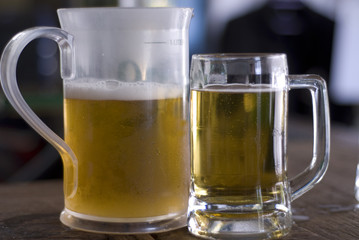 jug of beer and a mug of beer