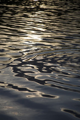 Night water in lake in beams of a decline