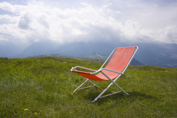 Chaise longue with a beautiful alpine scenic